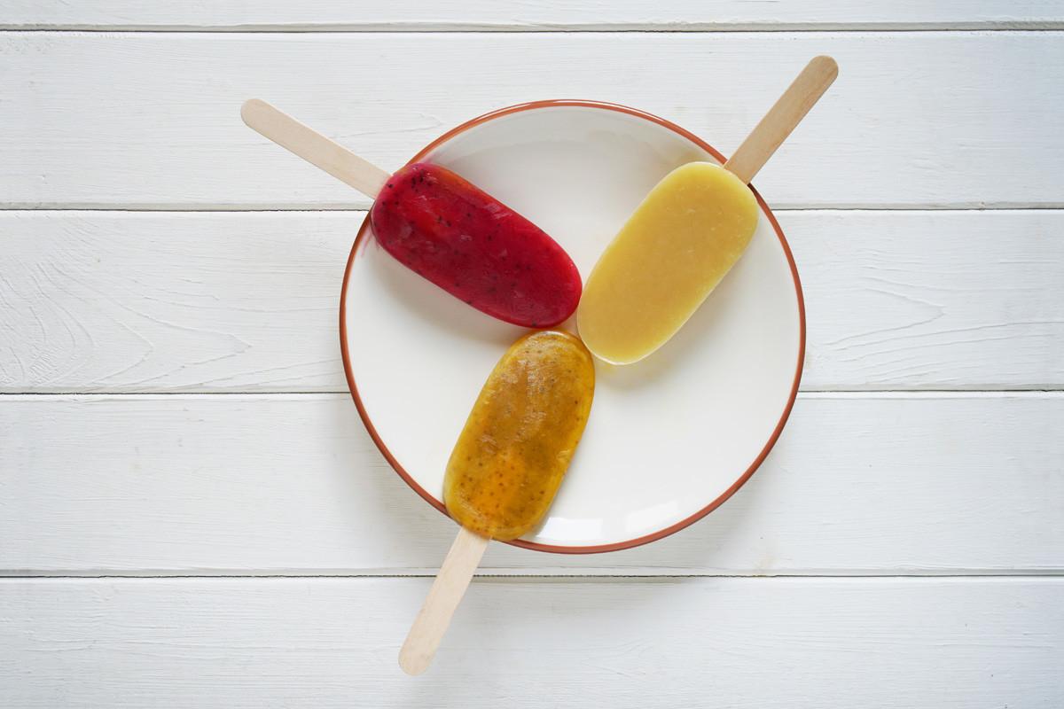 Three Different Fruit Smoothie Popsicles or Ice Pops on a Plate