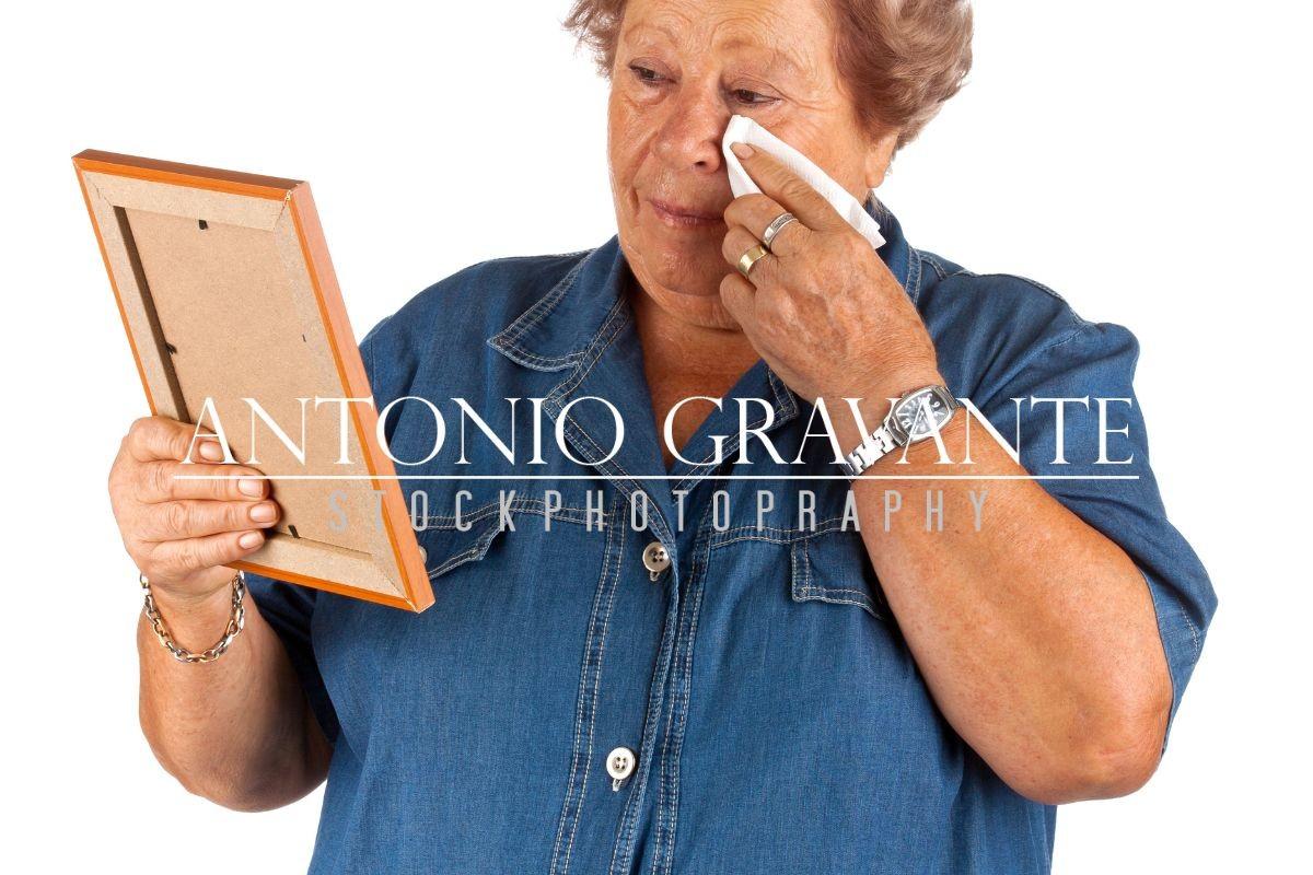 Old Lady Crying Watching a Blank Photo Frame