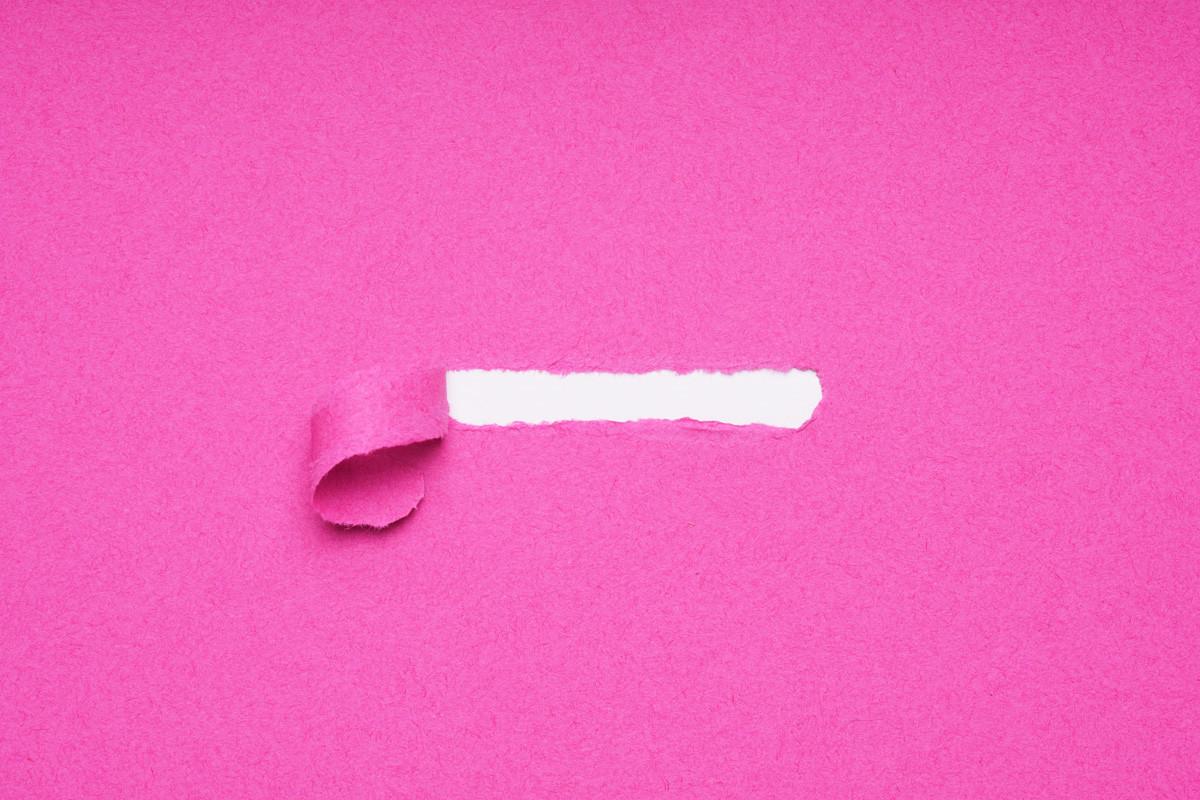 Peel Away Pink Torn Paper to Reveal Hidden Copy Space